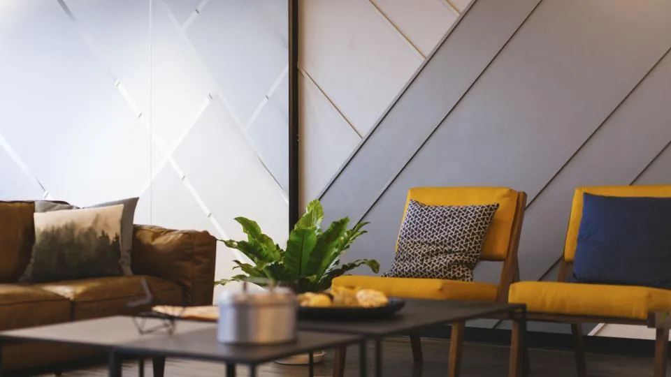 Living room with yellow chairs and light walls